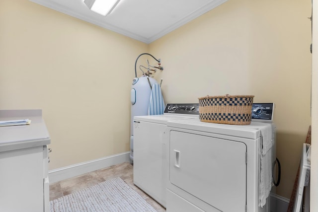 619 Pitts Bayshore Dr, Freeport, FL 32439 - washroom with crown molding, washing machine and dryer, and water heater