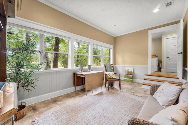 619 Pitts Bayshore Dr, Freeport, FL 32439 - tiled office space featuring wainscoting, crown molding, washer / dryer, a textured ceiling, and recessed lighting