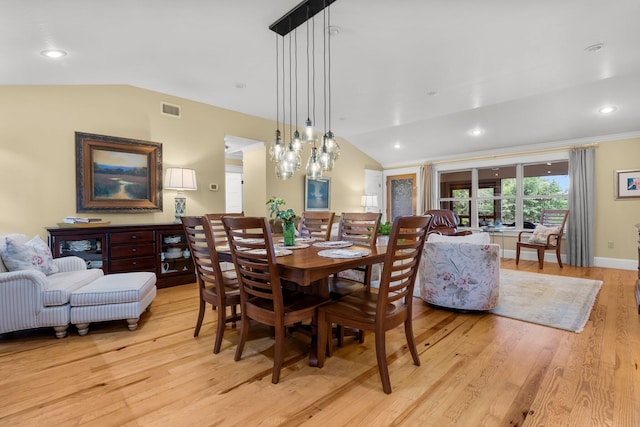 619 Pitts Bayshore Dr, Freeport, FL 32439 - dining room featuring vaulted ceiling, light wood finished floors, and recessed lighting