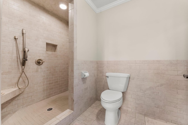 619 Pitts Bayshore Dr, Freeport, FL 32439 - full bathroom featuring a shower stall, tile patterned flooring, crown molding, wainscoting, and tile walls