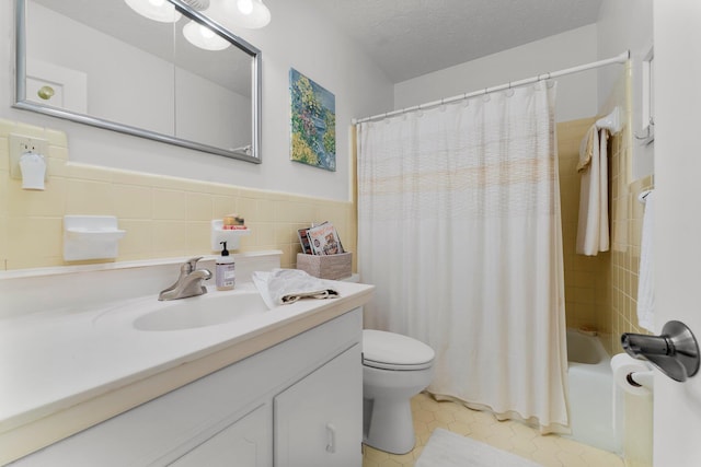 619 Pitts Bayshore Dr, Freeport, FL 32439 - bathroom featuring vanity, shower / bathtub combination with curtain, tile patterned flooring, tile walls, and a wainscoted wall