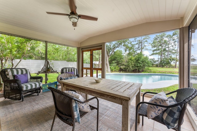 619 Pitts Bayshore Dr, Freeport, FL 32439 - sunroom with lofted ceiling, ceiling fan, an outdoor hangout area, and outdoor dining space