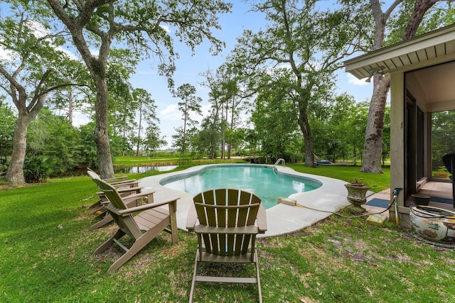 619 Pitts Bayshore Dr, Freeport, FL 32439 - swimming pool with a yard, a water view, and view of wooded area