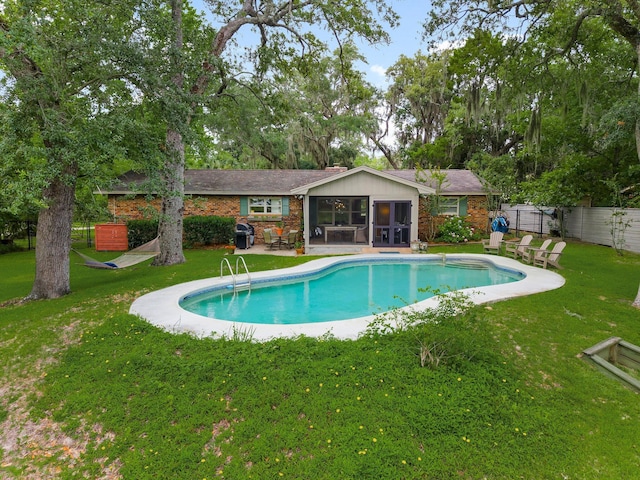 619 Pitts Bayshore Dr, Freeport, FL 32439 - view of pool featuring a sunroom and area for grilling