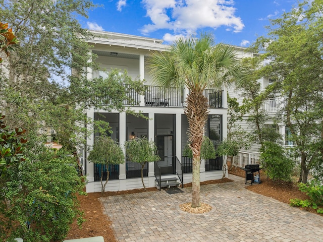 221 Seacrest Beach Blvd E, Seacrest, FL 32461 - rear view of property with a balcony