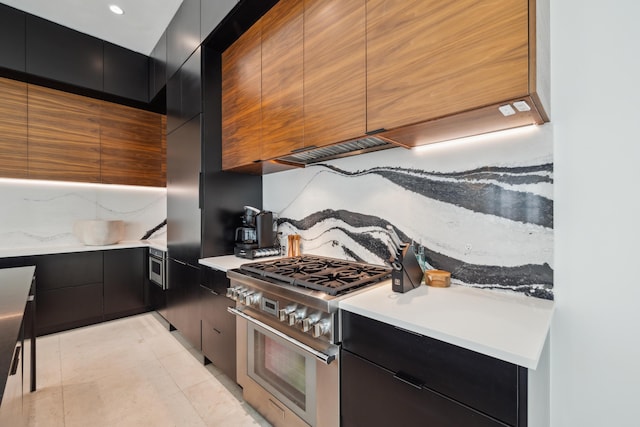 36 Caliza Ln, Inlet Beach, FL 32461 - kitchen featuring modern cabinets, stainless steel range, dark cabinets, and decorative backsplash