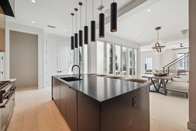 36 Caliza Ln, Inlet Beach, FL 32461 - kitchen with dark countertops, modern cabinets, an island with sink, recessed lighting, and decorative light fixtures