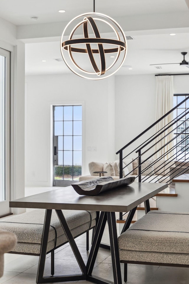 36 Caliza Ln, Inlet Beach, FL 32461 - dining space with healthy amount of natural light, recessed lighting, a chandelier, and stairs