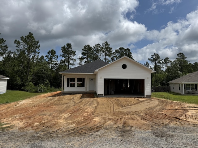 379 N Raphael Rd, Defuniak Springs, FL 32433 - view of front of home with a garage and dirt driveway