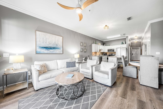 231 Somerset Bridge Rd Unit 2307, Santa Rosa Beach, FL 32459 - living room featuring wood finished floors, ornamental molding, and ceiling fan