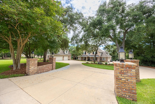 17 Poquito Rd, Shalimar, FL 32579 - view of front of home with a front lawn, curved driveway, and an attached garage