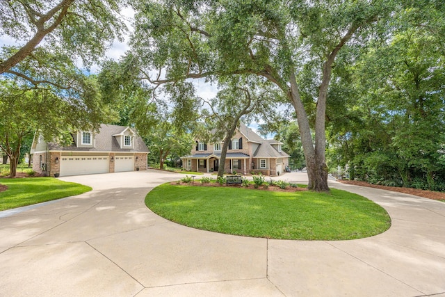 17 Poquito Rd, Shalimar, FL 32579 - traditional home with driveway, a front lawn, a garage, and brick siding