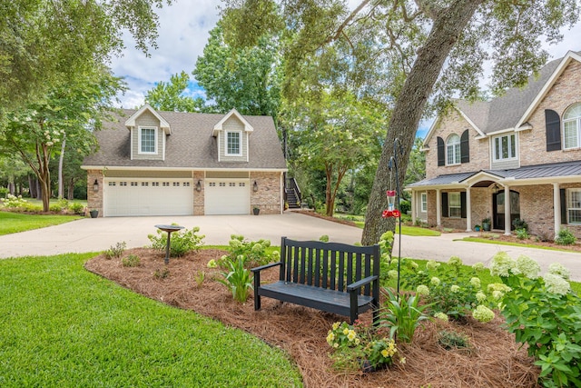 17 Poquito Rd, Shalimar, FL 32579 - view of front facade with driveway, brick siding, a front lawn, a standing seam roof, and an attached garage