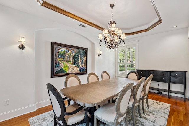 17 Poquito Rd, Shalimar, FL 32579 - dining room featuring a chandelier, wood finished floors, a tray ceiling, and recessed lighting