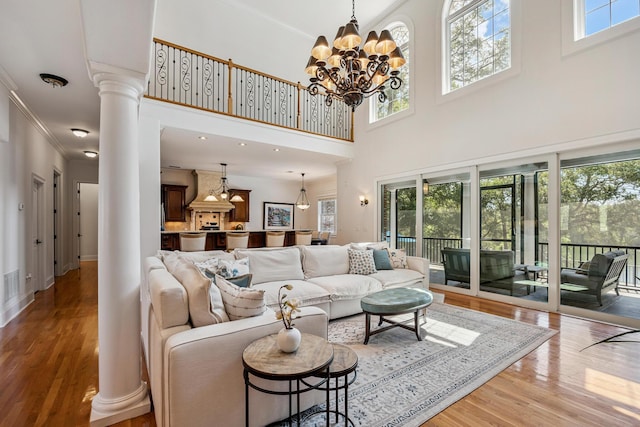 17 Poquito Rd, Shalimar, FL 32579 - living room with ornate columns, plenty of natural light, ornamental molding, and a high ceiling
