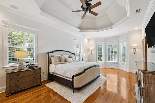 17 Poquito Rd, Shalimar, FL 32579 - bedroom with light wood finished floors, a tray ceiling, crown molding, and a ceiling fan