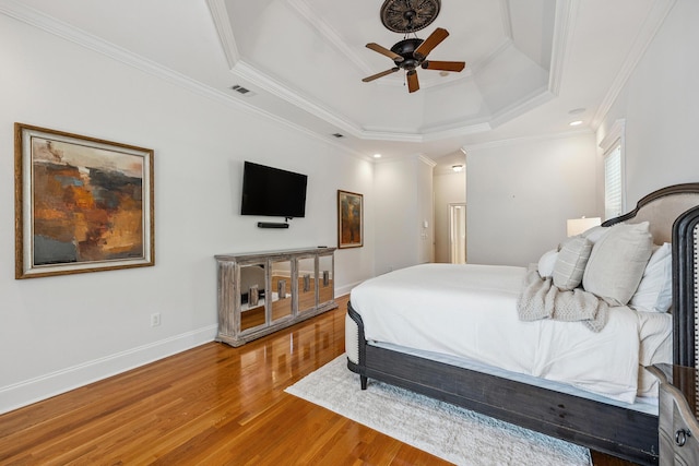 17 Poquito Rd, Shalimar, FL 32579 - bedroom with a tray ceiling, wood finished floors, crown molding, and a ceiling fan