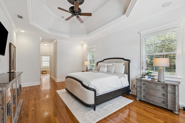 17 Poquito Rd, Shalimar, FL 32579 - bedroom with multiple windows, wood finished floors, a raised ceiling, crown molding, and a ceiling fan