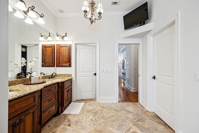 17 Poquito Rd, Shalimar, FL 32579 - full bath featuring vanity, crown molding, a chandelier, and stone finish floors