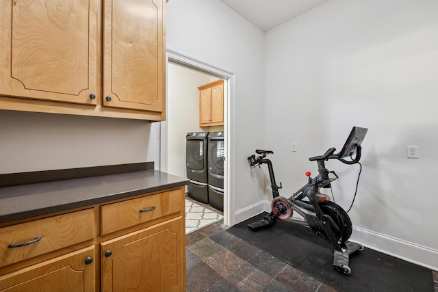 17 Poquito Rd, Shalimar, FL 32579 - workout area with washer and clothes dryer and dark stone finish flooring