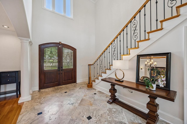 17 Poquito Rd, Shalimar, FL 32579 - foyer entrance featuring stairway, a towering ceiling, french doors, and decorative columns
