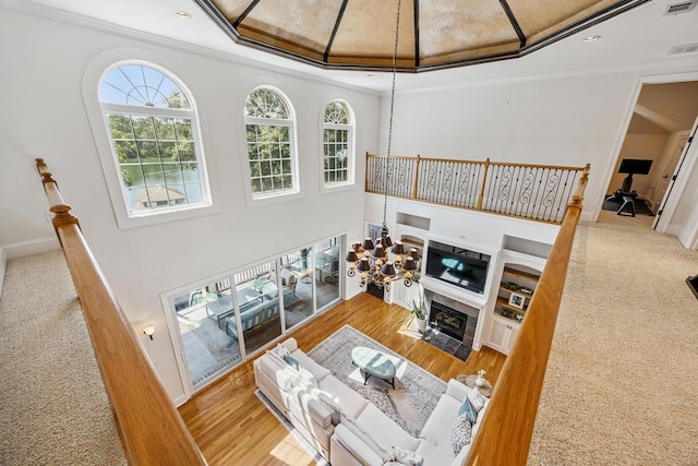 17 Poquito Rd, Shalimar, FL 32579 - carpeted living area featuring ornamental molding, a fireplace with flush hearth, and recessed lighting