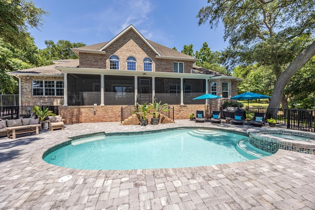 17 Poquito Rd, Shalimar, FL 32579 - view of pool featuring a sunroom, an outdoor living space, a patio, and a pool with connected hot tub