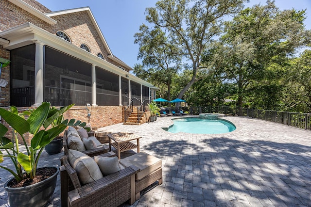 17 Poquito Rd, Shalimar, FL 32579 - view of pool featuring a sunroom, a patio area, and a pool with connected hot tub