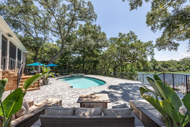 17 Poquito Rd, Shalimar, FL 32579 - view of swimming pool with an outdoor living space, a patio, a sunroom, a pool with connected hot tub, and view of scattered trees