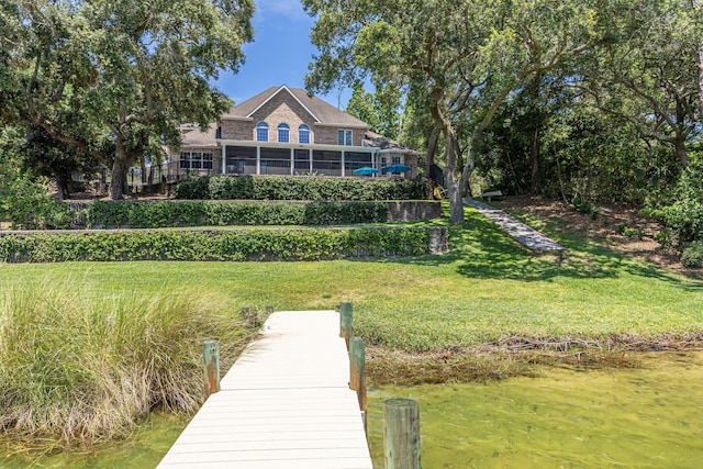 17 Poquito Rd, Shalimar, FL 32579 - back of property with brick siding, a yard, and a water view