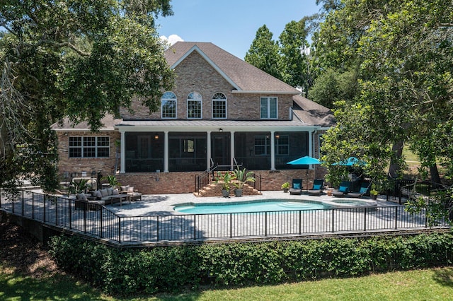 17 Poquito Rd, Shalimar, FL 32579 - back of property with a sunroom, outdoor lounge area, brick siding, and a patio