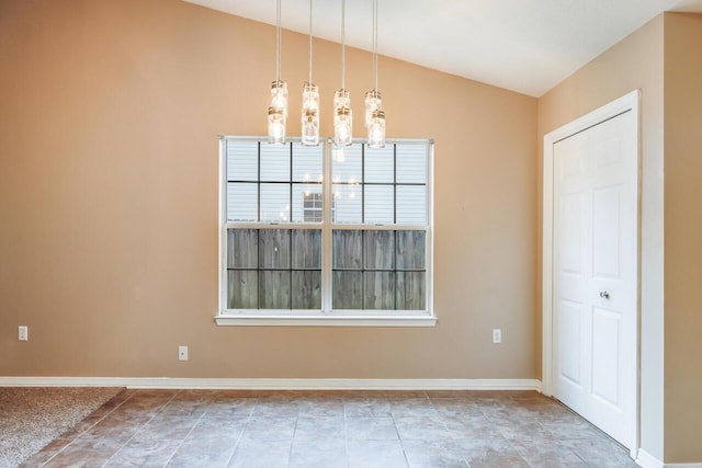 121 Trenton Ave, Crestview, FL 32539 - unfurnished dining area with vaulted ceiling and a chandelier