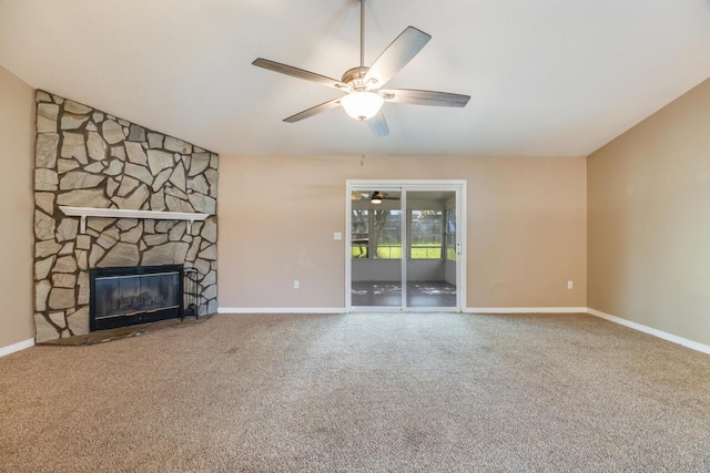 121 Trenton Ave, Crestview, FL 32539 - unfurnished living room featuring a ceiling fan, carpet floors, and a stone fireplace