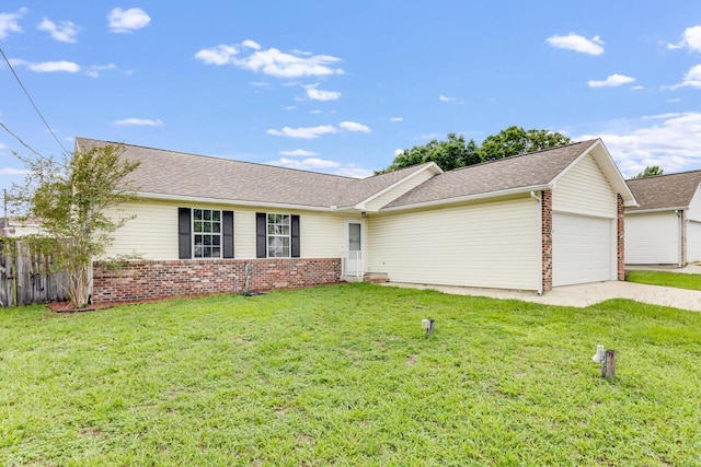 121 Trenton Ave, Crestview, FL 32539 - single story home with an attached garage, brick siding, and concrete driveway