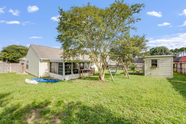 121 Trenton Ave, Crestview, FL 32539 - fenced backyard with a sunroom and a storage shed