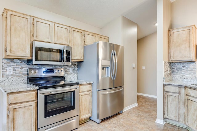 121 Trenton Ave, Crestview, FL 32539 - kitchen with stainless steel appliances and light brown cabinetry