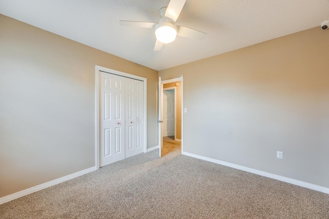 121 Trenton Ave, Crestview, FL 32539 - unfurnished bedroom with carpet, a closet, ceiling fan, and a textured ceiling