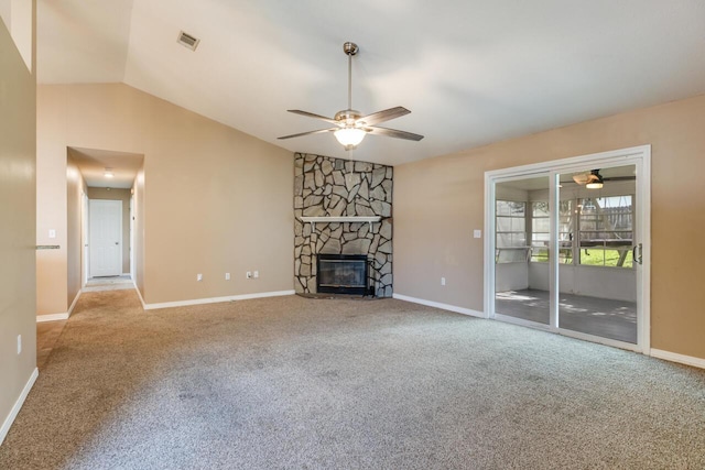 121 Trenton Ave, Crestview, FL 32539 - unfurnished living room with ceiling fan, lofted ceiling, carpet, and a stone fireplace