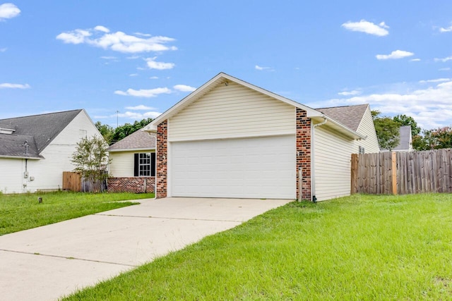 121 Trenton Ave, Crestview, FL 32539 - view of home's exterior featuring a garage, brick siding, driveway, and roof with shingles