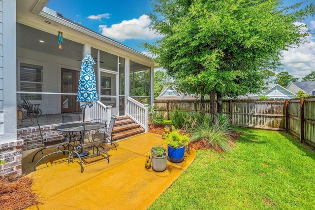 1502 Coriander Ln, Niceville, FL 32578 - fenced backyard featuring a patio area and a sunroom