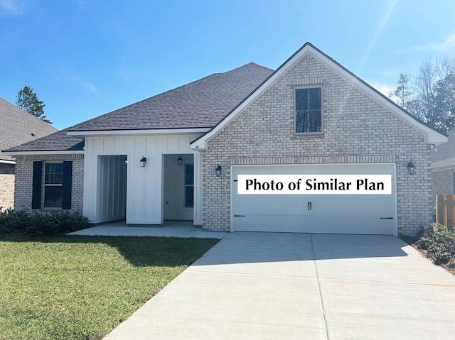 2743 Louis Cir, Crestview, FL 32536 - view of front of home featuring brick siding, driveway, and roof with shingles