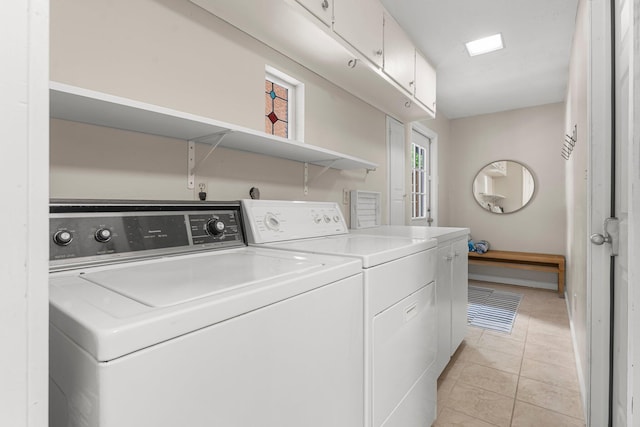81 Canal St, Santa Rosa Beach, FL 32459 - laundry area featuring separate washer and dryer, cabinet space, and light tile patterned flooring
