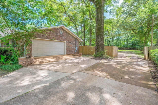 6060 Bud Moulton Rd, Crestview, FL 32536 - view of side of property with brick siding, driveway, and an attached garage