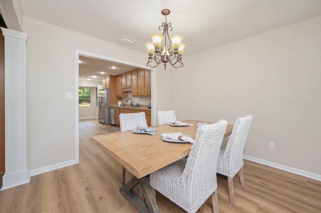 6060 Bud Moulton Rd, Crestview, FL 32536 - dining room with a chandelier, light wood-type flooring, and recessed lighting