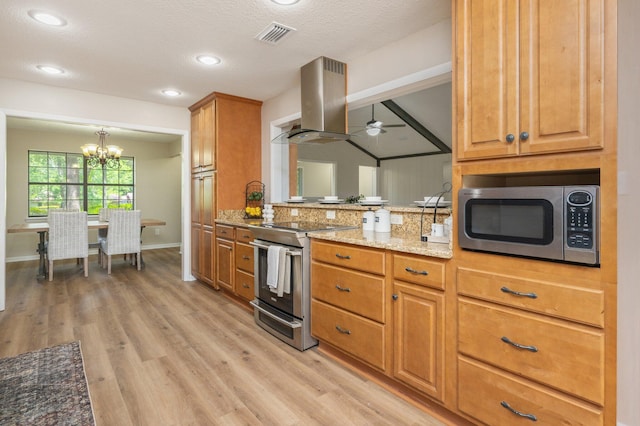 6060 Bud Moulton Rd, Crestview, FL 32536 - kitchen with appliances with stainless steel finishes, island exhaust hood, light wood-type flooring, a chandelier, and light stone counters
