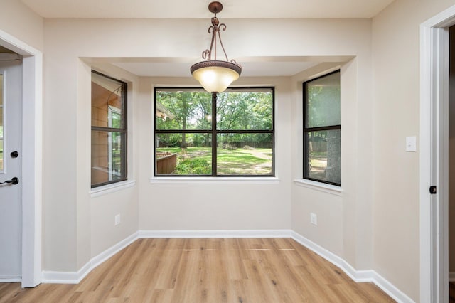 6060 Bud Moulton Rd, Crestview, FL 32536 - unfurnished dining area with light wood-style floors and baseboards