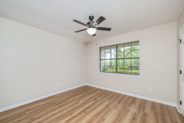 6060 Bud Moulton Rd, Crestview, FL 32536 - spare room featuring light wood-style flooring, ceiling fan, and a textured ceiling