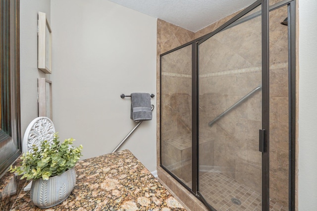 6060 Bud Moulton Rd, Crestview, FL 32536 - bathroom featuring a shower stall and a textured ceiling