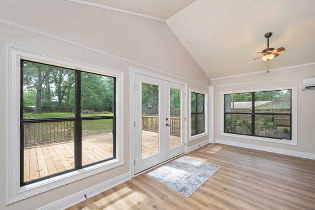 6060 Bud Moulton Rd, Crestview, FL 32536 - unfurnished sunroom featuring french doors, vaulted ceiling, and an AC wall unit