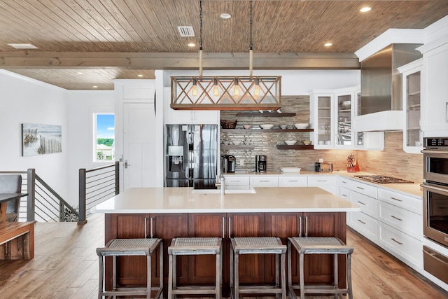 64 S Emerald Cove Ln, Inlet Beach, FL 32461 - kitchen featuring appliances with stainless steel finishes, a kitchen island with sink, light wood-style floors, tasteful backsplash, and wood ceiling